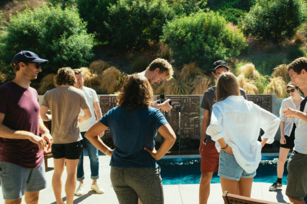 Group of People Standing Beside Pool