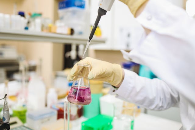 Scientist in Laboratory Conducting an Experiment