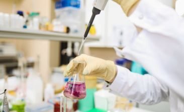 Scientist in Laboratory Conducting an Experiment